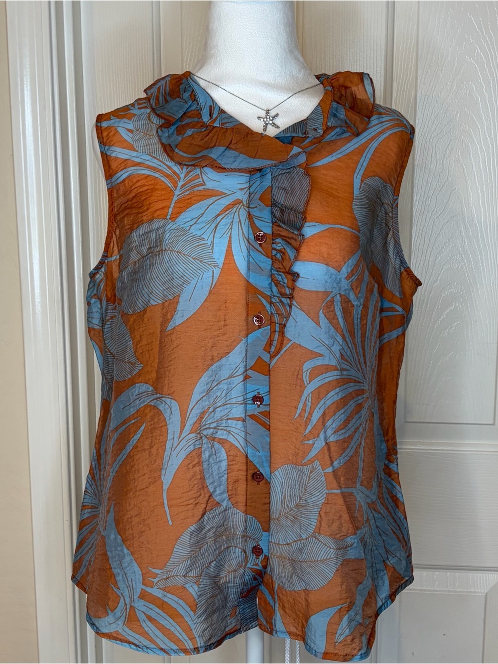CAbi Sheer Blouse in Rust & Slate Blue Tropical print.